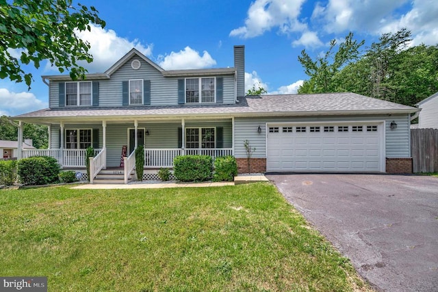 11714 Falcon Ridge Dr, Fredericksburg, VA 22407 - view of front facade featuring driveway, an attached garage, a chimney, a porch, and brick siding