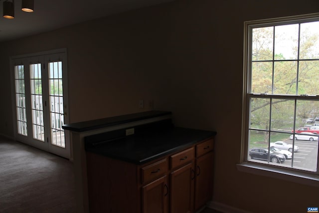 1508 Villa Ter Unit F, Charlottesville, VA 22903 - kitchen with dark countertops and baseboards