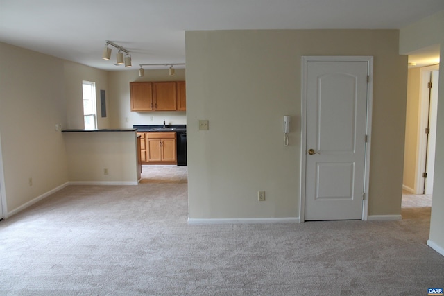 1508 Villa Ter Unit F, Charlottesville, VA 22903 - unfurnished room featuring baseboards, light carpet, and track lighting