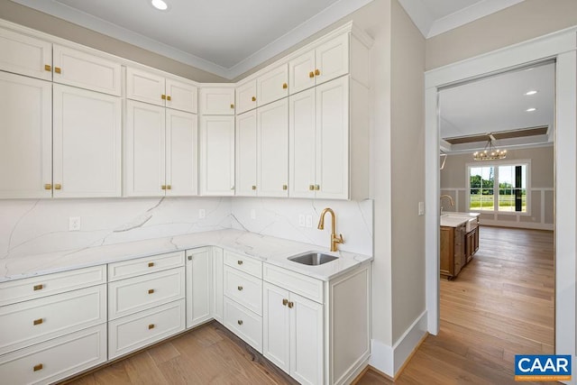 100 Stable Ln, Lynchburg, VA 24503 - kitchen featuring crown molding, a chandelier, light wood-style flooring, light stone countertops, and white cabinetry
