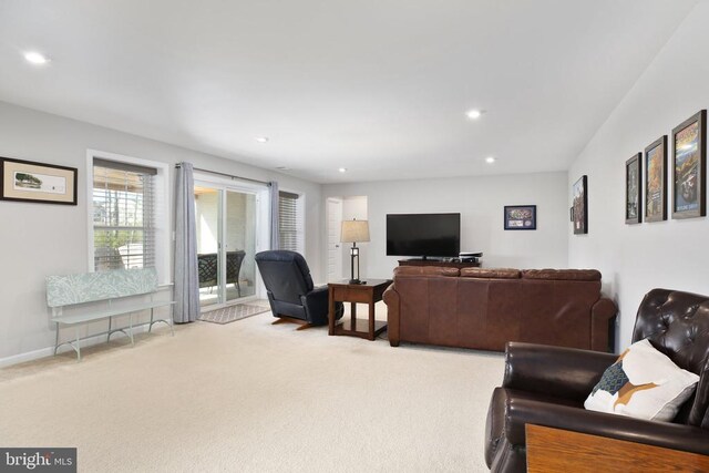 living room featuring carpet flooring and recessed lighting