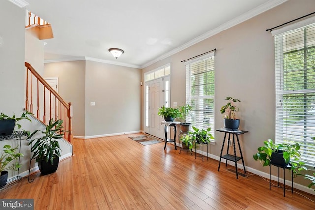 230 Whitworth Dr, Culpeper, VA 22701 - foyer entrance with stairway, baseboards, wood finished floors, and ornamental molding