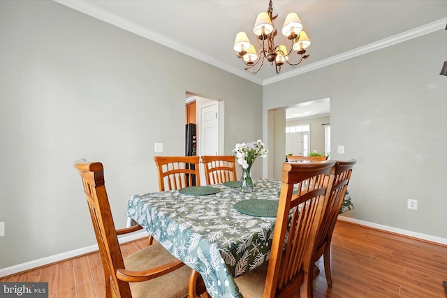 230 Whitworth Dr, Culpeper, VA 22701 - dining room with a chandelier, wood finished floors, baseboards, and crown molding