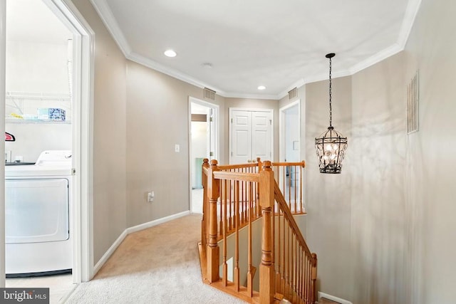 230 Whitworth Dr, Culpeper, VA 22701 - hall featuring washer / dryer, an upstairs landing, a chandelier, light carpet, and baseboards