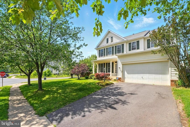 230 Whitworth Dr, Culpeper, VA 22701 - traditional home with a front yard, asphalt driveway, a garage, and brick siding