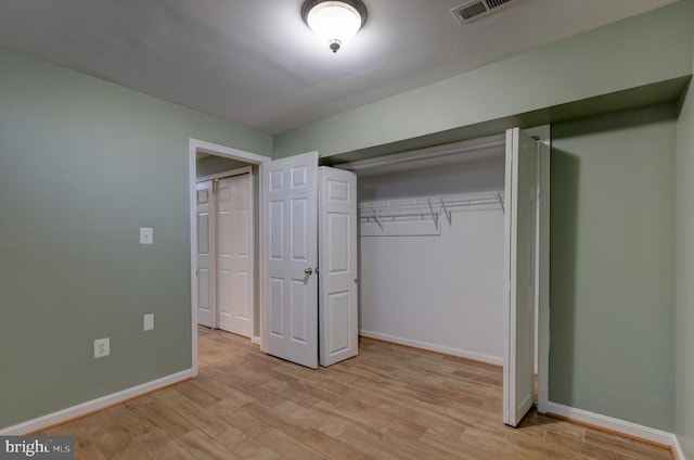 2018 Silver Bell Ct, Culpeper, VA 22701 - unfurnished bedroom with light wood-type flooring and a closet