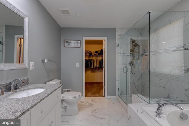 2018 Silver Bell Ct, Culpeper, VA 22701 - full bath with marble finish flooring, a marble finish shower, vanity, a bath, and a spacious closet