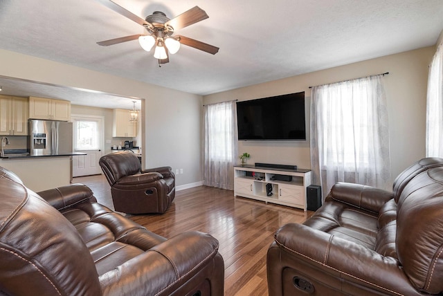 324 Rustic Ave, Broadway, VA 22815 - living area featuring wood finished floors, a ceiling fan, and baseboards