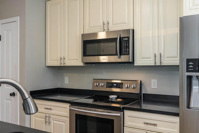 324 Rustic Ave, Broadway, VA 22815 - kitchen featuring stainless steel appliances, dark countertops, white cabinetry, and a sink