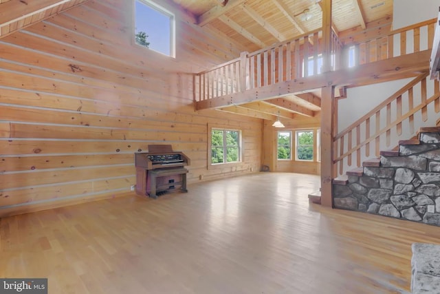 6403 Zachary Taylor Hwy, Culpeper, VA 22701 - unfurnished living room featuring high vaulted ceiling, wood finished floors, stairs, beamed ceiling, and wood ceiling