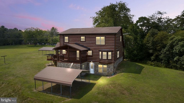 6403 Zachary Taylor Hwy, Culpeper, VA 22701 - rear view of house featuring stone siding, a yard, and a wooden deck