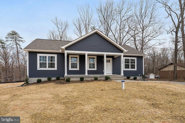 6000 Bills Rd, Mineral, VA 23117 - view of front facade with a porch, a shingled roof, and a front yard