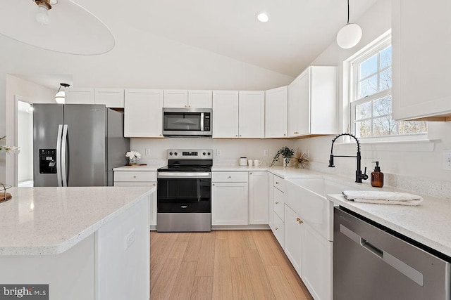 6000 Bills Rd, Mineral, VA 23117 - kitchen with stainless steel appliances, lofted ceiling, white cabinets, a sink, and light stone counters