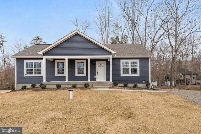 6000 Bills Rd, Mineral, VA 23117 - view of front facade featuring a porch, roof with shingles, and a front lawn