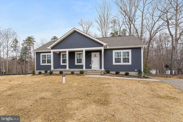 6000 Bills Rd, Mineral, VA 23117 - view of front facade featuring a porch, a shingled roof, and a front yard