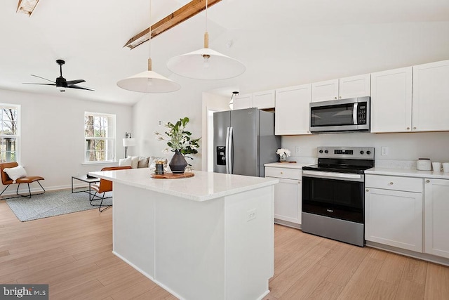 6000 Bills Rd, Mineral, VA 23117 - kitchen featuring appliances with stainless steel finishes, light wood-style flooring, open floor plan, a center island, and high vaulted ceiling