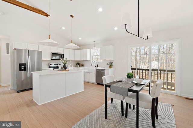 6000 Bills Rd, Mineral, VA 23117 - dining room with beamed ceiling, light wood-style flooring, high vaulted ceiling, recessed lighting, and baseboards