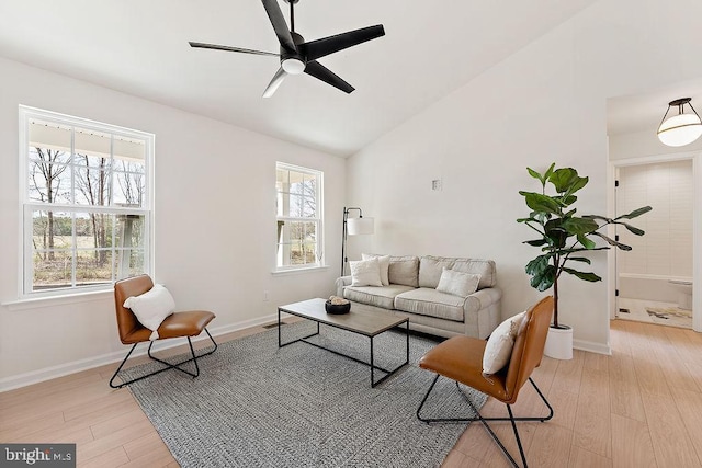 6000 Bills Rd, Mineral, VA 23117 - living area with lofted ceiling, plenty of natural light, a ceiling fan, light wood finished floors, and baseboards