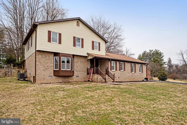 9150 James Madison Hwy, Warrenton, VA 20186 - view of front of property with brick siding, a front lawn, and crawl space