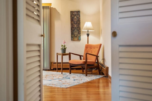 616 Lynn Ln, Waynesboro, VA 22980 - sitting room featuring wood finished floors and a baseboard heating unit