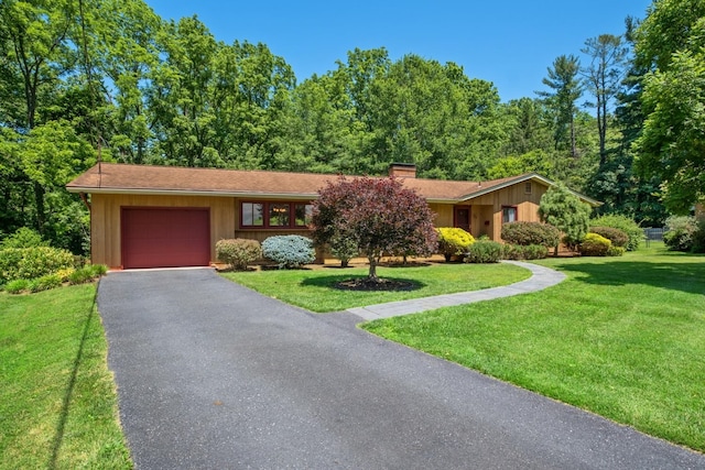 616 Lynn Ln, Waynesboro, VA 22980 - view of front of property featuring a garage, a front yard, a chimney, and driveway