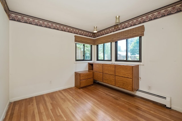 616 Lynn Ln, Waynesboro, VA 22980 - empty room with light wood-style floors and a baseboard radiator