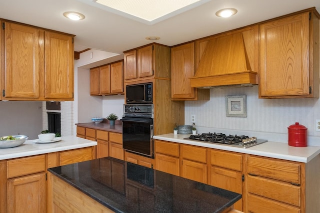 616 Lynn Ln, Waynesboro, VA 22980 - kitchen featuring black appliances, premium range hood, and brown cabinets