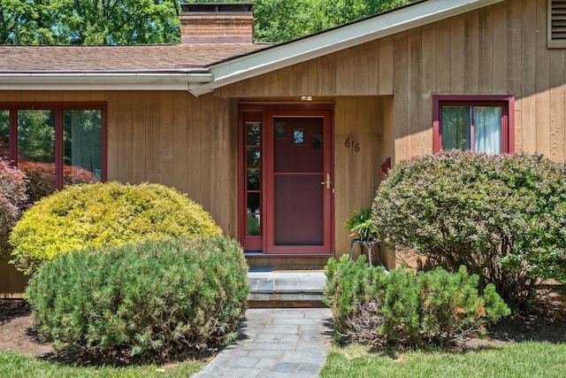616 Lynn Ln, Waynesboro, VA 22980 - view of exterior entry with a chimney and roof with shingles