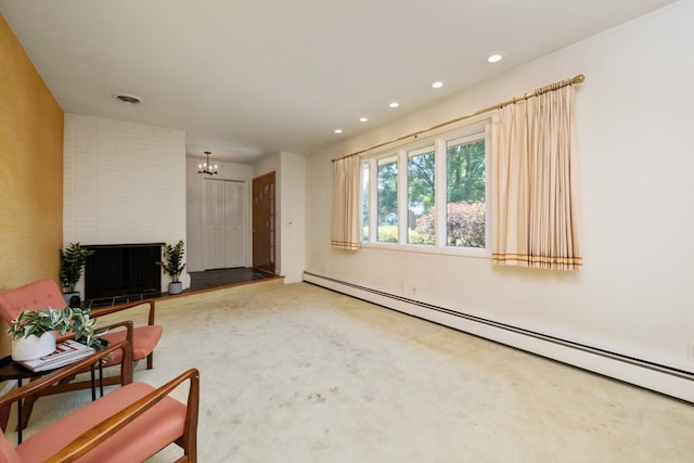 616 Lynn Ln, Waynesboro, VA 22980 - carpeted living room with a baseboard heating unit, a chandelier, recessed lighting, and a brick fireplace