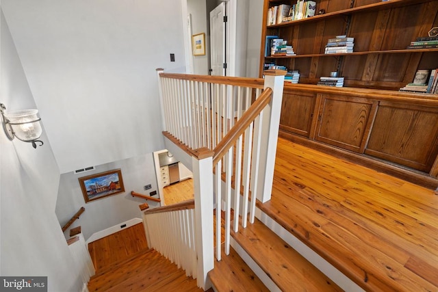  - stairway with hardwood / wood-style flooring