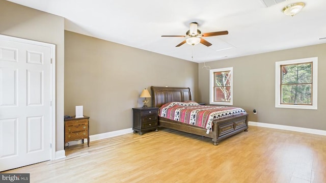 974 Cross Mountain Rd, Luray, VA 22835 - bedroom featuring attic access, light wood-type flooring, baseboards, and ceiling fan