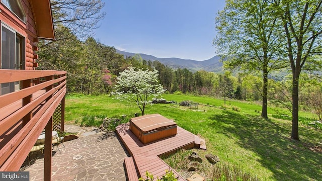 974 Cross Mountain Rd, Luray, VA 22835 - view of yard with a hot tub, a deck with mountain view, a view of trees, and a patio area
