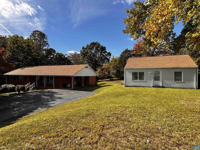 1704 Old Brook Rd Unit 1700, Charlottesville, VA 22901 - exterior space with a front lawn, a carport, and aphalt driveway