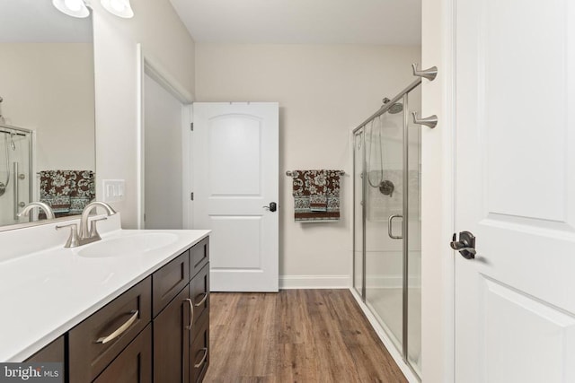 1315 Eastover Pkwy, Locust Grove, VA 22508 - bathroom with vanity, a stall shower, and wood finished floors