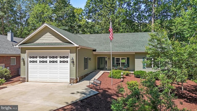 1315 Eastover Pkwy, Locust Grove, VA 22508 - view of front of house featuring an attached garage, driveway, and roof with shingles