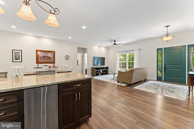 1315 Eastover Pkwy, Locust Grove, VA 22508 - kitchen featuring refrigerator, wood finished floors, pendant lighting, ceiling fan, and dark brown cabinetry