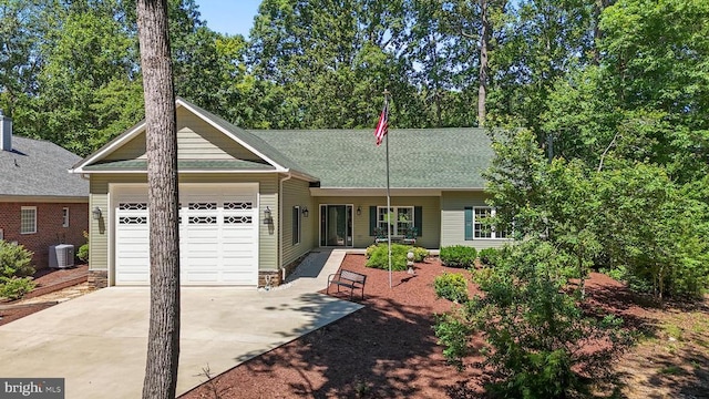 1315 Eastover Pkwy, Locust Grove, VA 22508 - single story home featuring concrete driveway, a garage, and roof with shingles