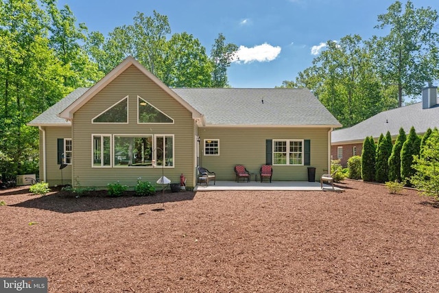 1315 Eastover Pkwy, Locust Grove, VA 22508 - rear view of house featuring a patio area and a shingled roof