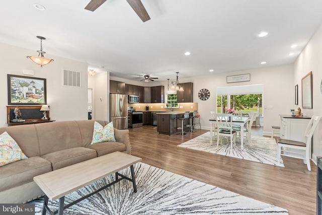 1315 Eastover Pkwy, Locust Grove, VA 22508 - living area featuring a ceiling fan, wood finished floors, and recessed lighting