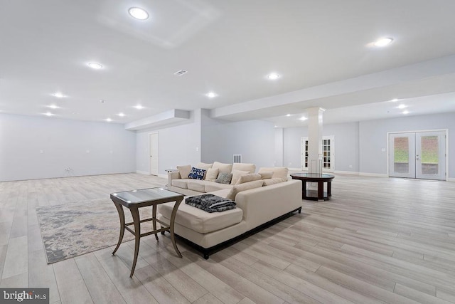 7308 Glenhaven Dr, Fredericksburg, VA 22407 - living area featuring french doors, light wood finished floors, and recessed lighting