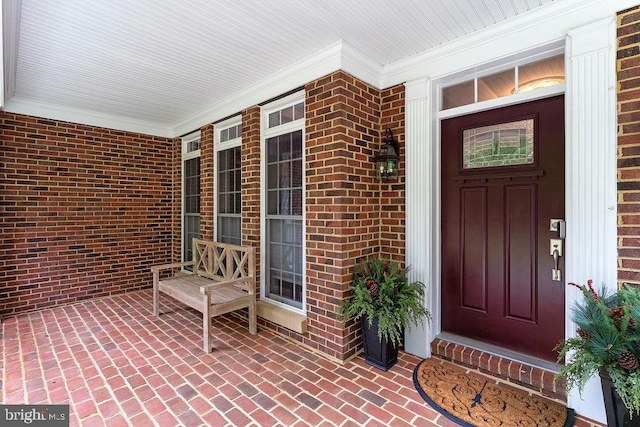 7308 Glenhaven Dr, Fredericksburg, VA 22407 - property entrance featuring a porch and brick siding