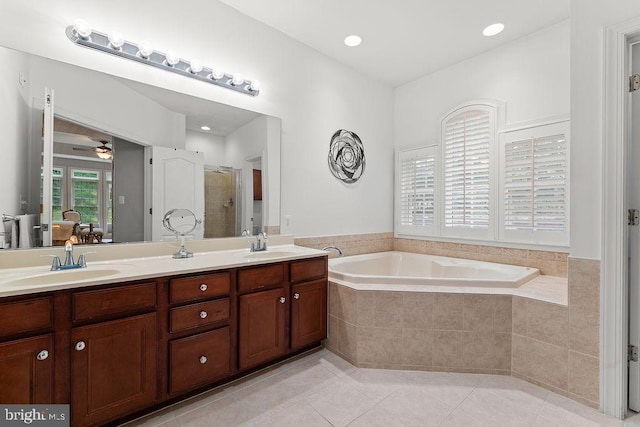 7308 Glenhaven Dr, Fredericksburg, VA 22407 - ensuite bathroom with double vanity, a bath, tile patterned flooring, a stall shower, and ceiling fan