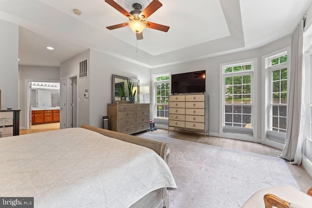 7308 Glenhaven Dr, Fredericksburg, VA 22407 - bedroom with a tray ceiling, light wood finished floors, ensuite bath, recessed lighting, and ceiling fan