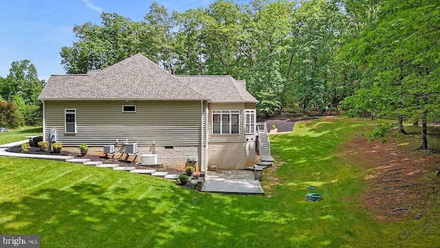7308 Glenhaven Dr, Fredericksburg, VA 22407 - rear view of house with a lawn, roof with shingles, and stairs