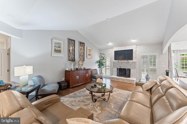 7308 Glenhaven Dr, Fredericksburg, VA 22407 - living area featuring vaulted ceiling, wood finished floors, and a fireplace