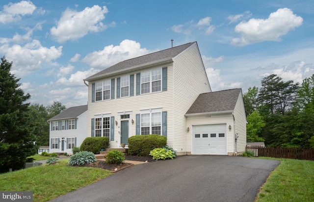 11106 Polaris Ct, Fredericksburg, VA 22407 - colonial inspired home featuring a garage, driveway, and a shingled roof