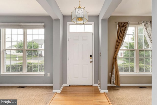 11106 Polaris Ct, Fredericksburg, VA 22407 - foyer featuring healthy amount of natural light, a chandelier, and baseboards