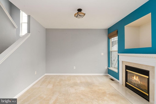 11106 Polaris Ct, Fredericksburg, VA 22407 - unfurnished living room featuring carpet flooring, a premium fireplace, plenty of natural light, and baseboards
