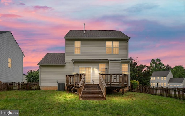 11106 Polaris Ct, Fredericksburg, VA 22407 - back of property at dusk with a wooden deck, central AC unit, and roof with shingles