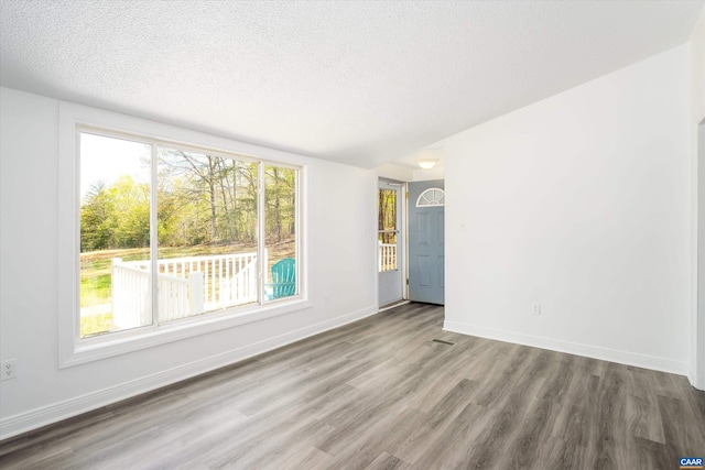 817 Brownings Cv, Shipman, VA 22971 - empty room featuring wood finished floors, a textured ceiling, and baseboards